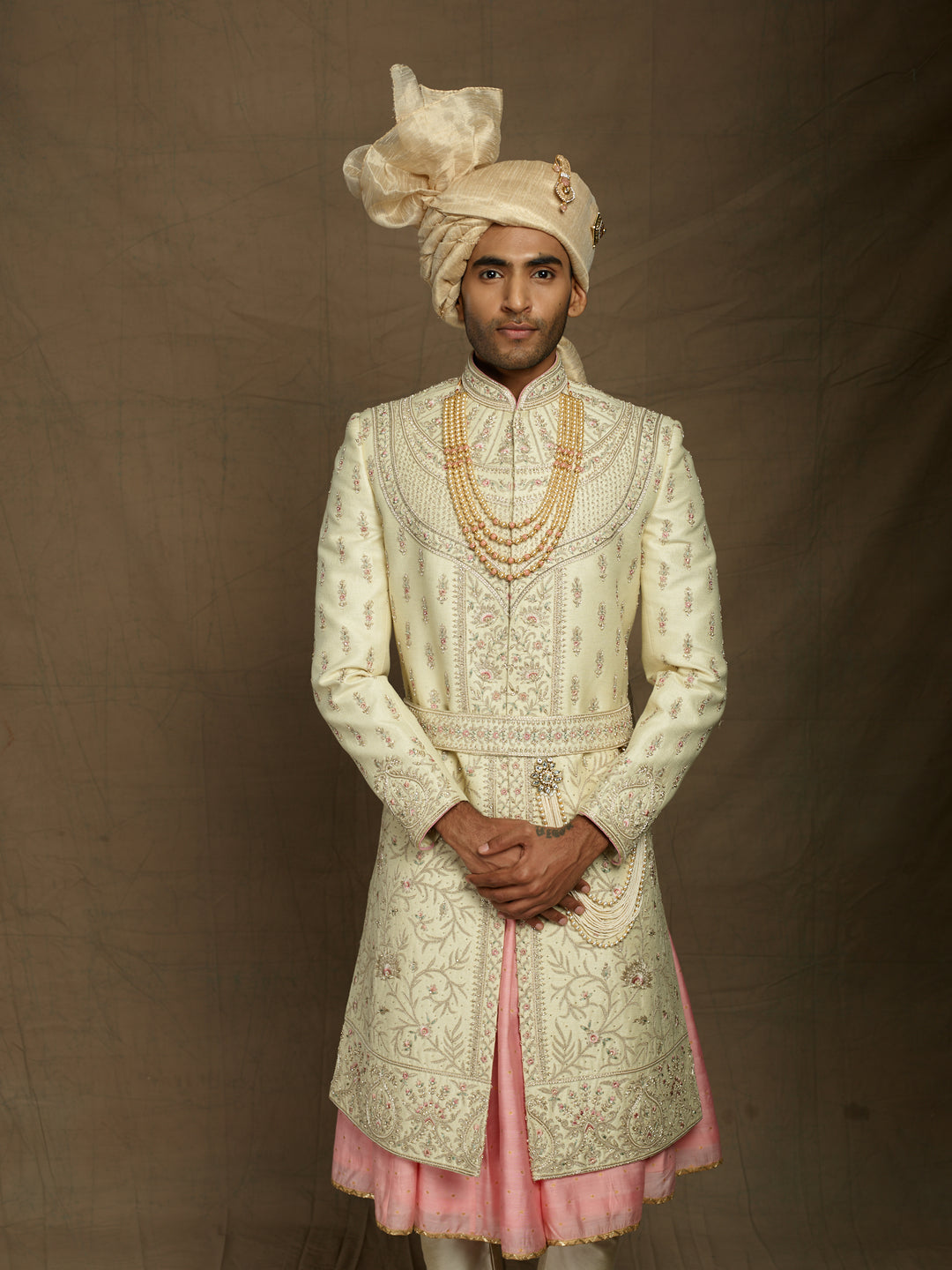 Heavy groom's wear sherwani with pink combination.