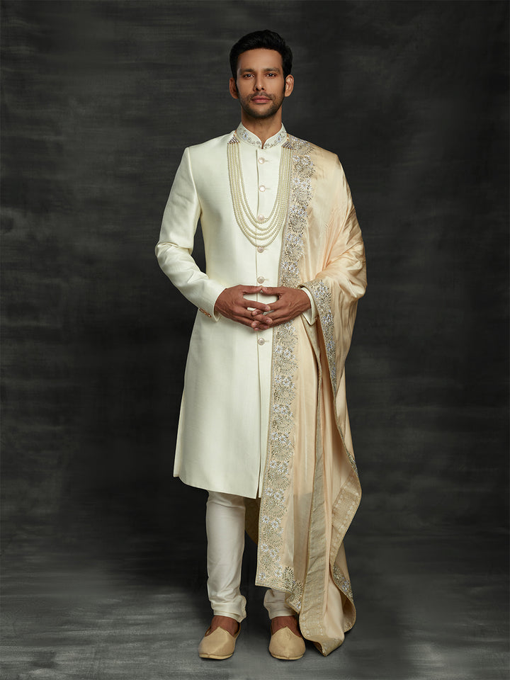 Off white sherwani with gold dupatta