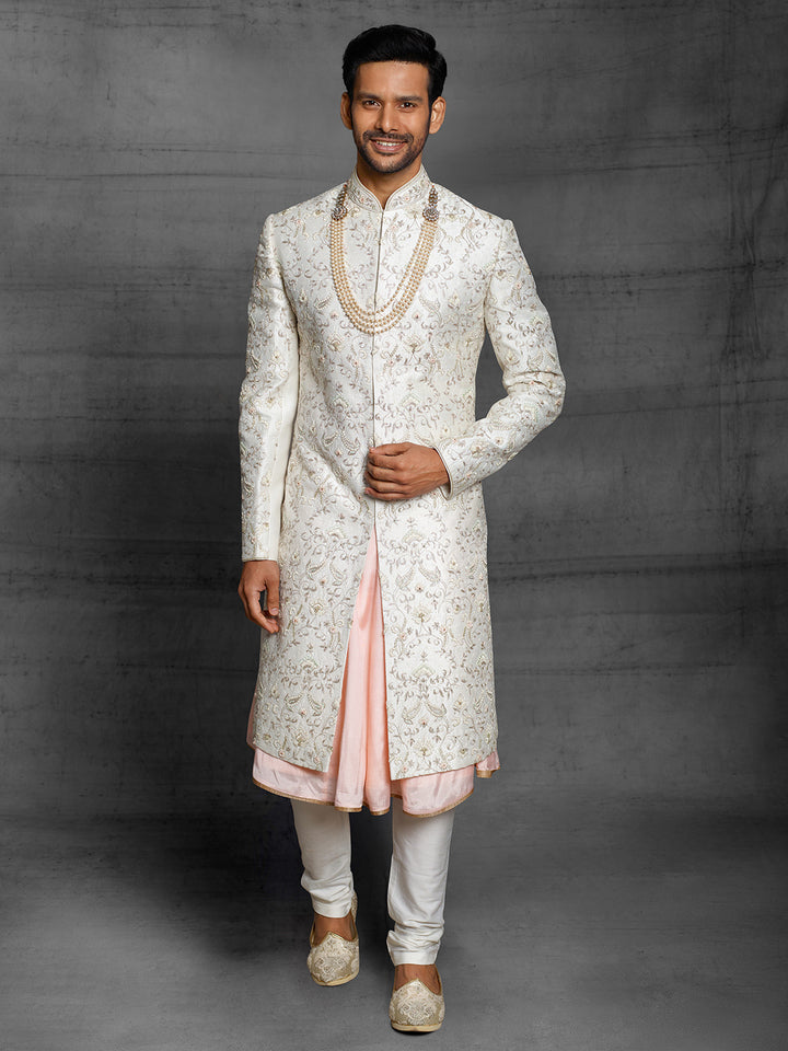 Ivory sherwani with overall resham work floral jaal.