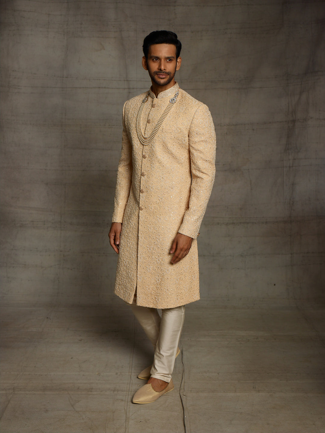 Simple sherwani in gold color
