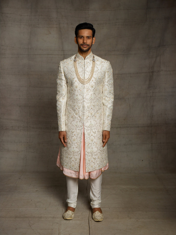 Ivory sherwani with overall resham work floral jaal.