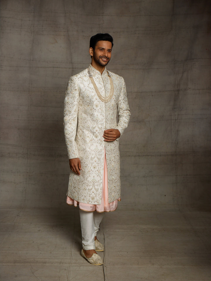 Ivory sherwani with overall resham work floral jaal.