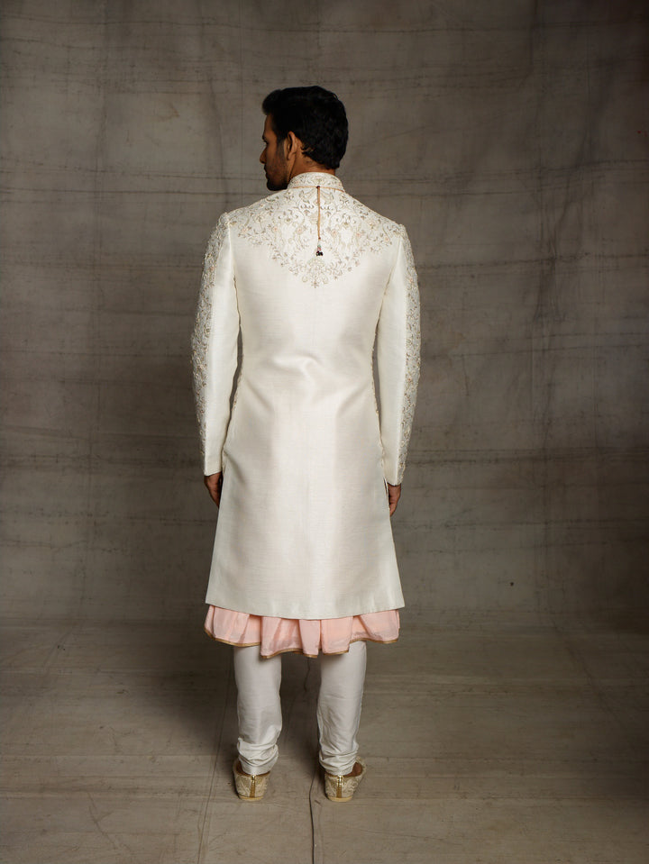 Ivory sherwani with overall resham work floral jaal.