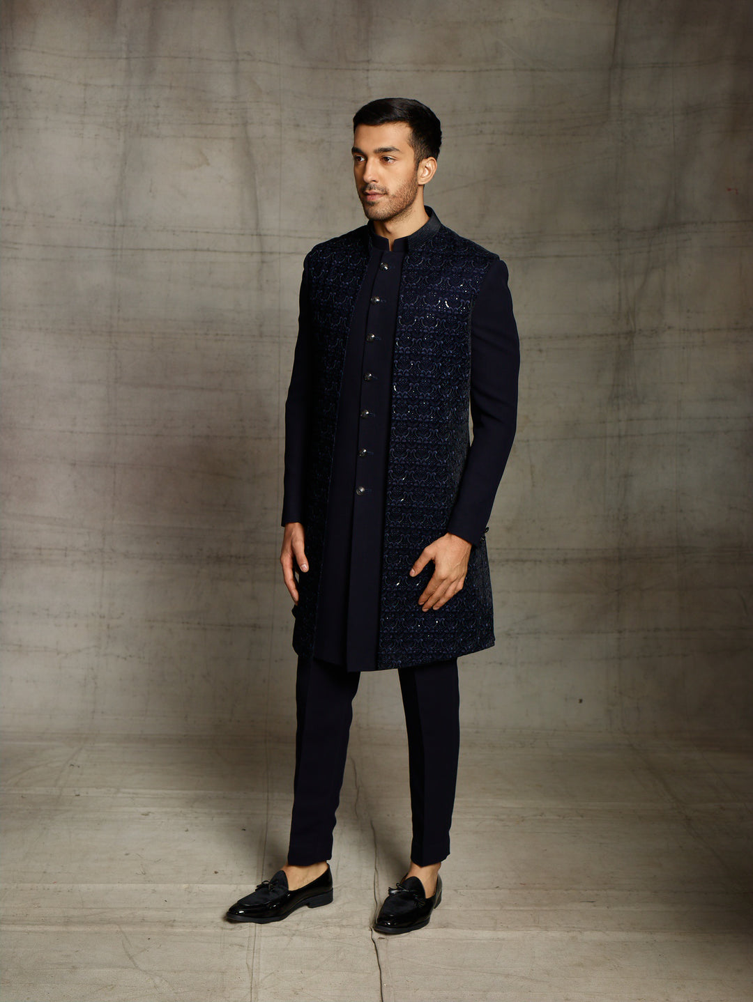 Blue indo-western with front open sleeveless velvet jacket.