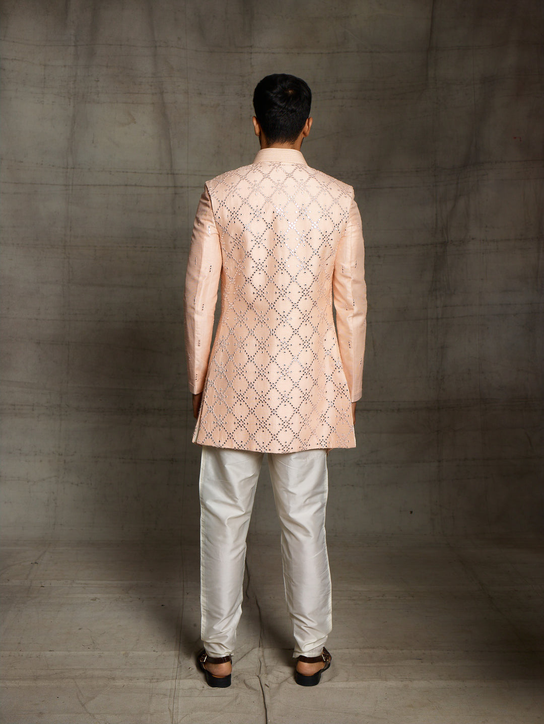 Peach kurta with sleeveless front open jacket.