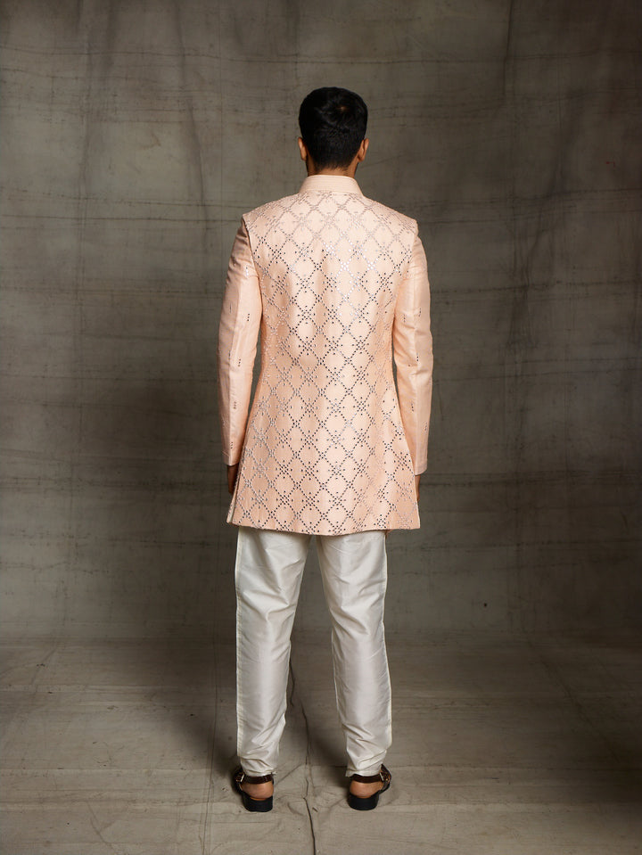 Peach kurta with sleeveless front open jacket.